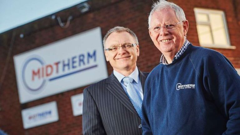 midtherm logo on building with people